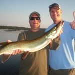 Clients Doug and Kurt with a nice post frontal musky in early July 2013.