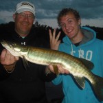 Father son clients Mark and Kale from Kansas and fish 3 of 3 on a triple on the first day of their 1.5 day fishing trip. Mark's first musky ever!