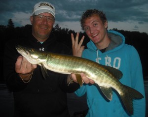 Father son clients Mark and Kale from Kansas and fish 3 of 3 on a triple on the first day of their 1.5 day fishing trip. Mark's first musky ever!